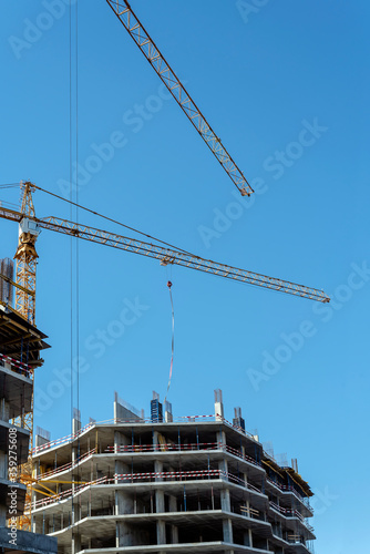 Construction site with crane. High-rise building construction.