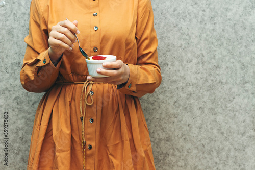 closeup woman eating algerian homemade vanilla caramel custard desert, flan