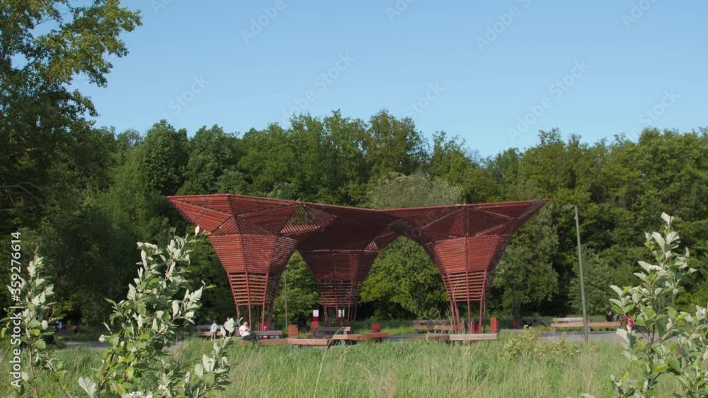 city park with wooden arbors under blue sky on sunny day city park with wooden arbors under blue sky on sunny day
