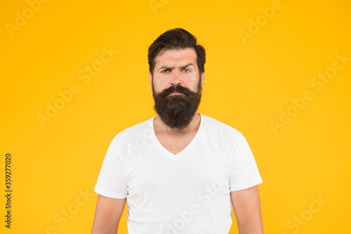 Facial care. male summer fashion. mature hipster has perfect moustache. serious looking guy. male barber care. get style in barbershop. bright life living. brutal bearded man on yellow background