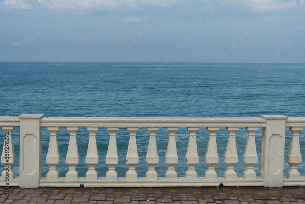 View from the embankment to the sea. Railing. The base for the postcard, the place for the text. View from the embankment to the sea. Railing. The base for the postcard, the place for the text.
