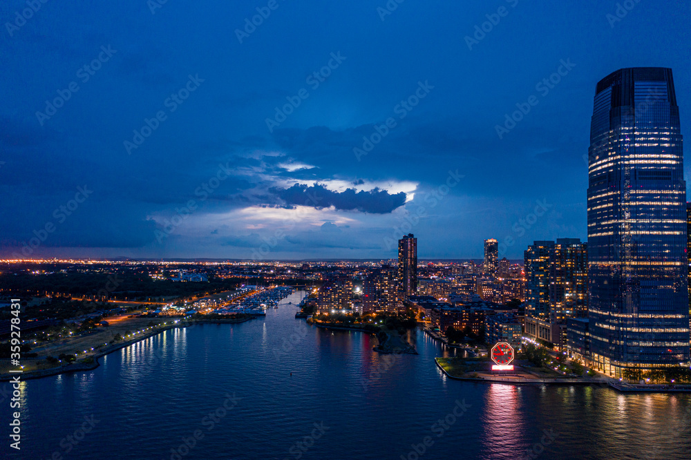 Aerial view of Jersey City Skyline with Morris Canal Park at Dusk. 