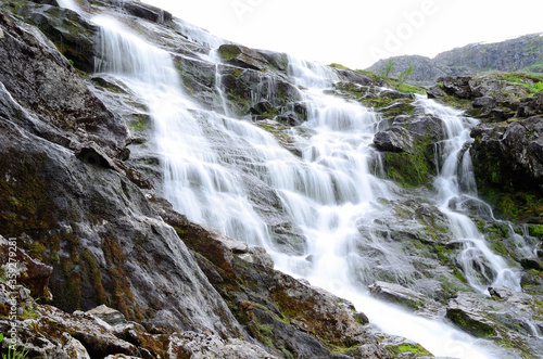 clean fresh water stream running down mountain side in summer landscape