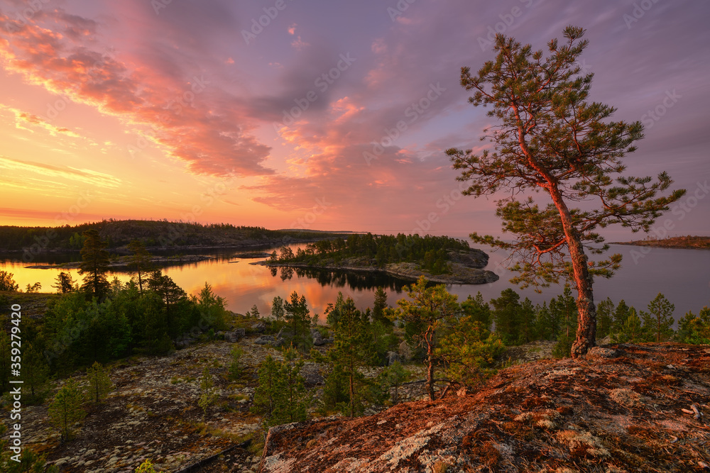 Pink dawn over the Islands of lake Ladoga, Republic of Karelia, Russia