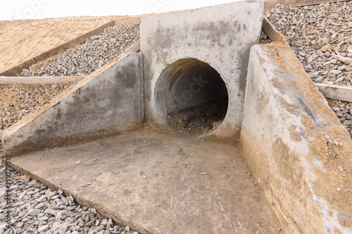 Bild auf Leinwand Installation of culvert drainage pipe and ditch structures under the highway
