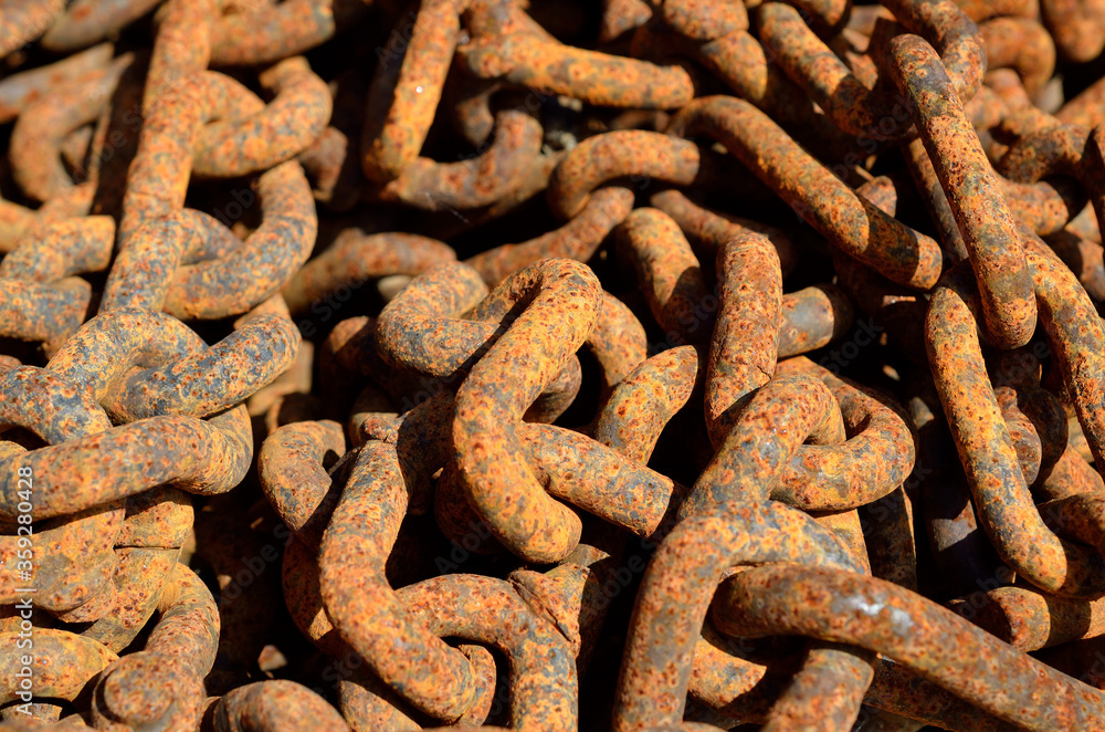 beautiful old rusted chains in a pile in summer sunlight beautiful old rusted chains in a pile in summer sunlight