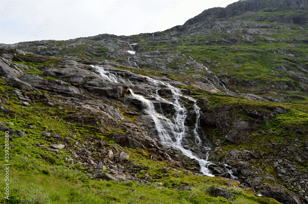 clean fresh water stream running down mountain side in summer landscape