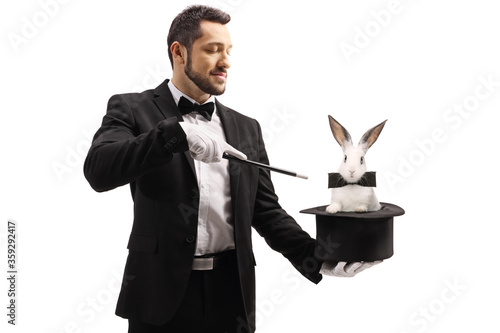 Magician oing a trick with a top hat and a rabbit