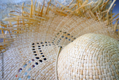 A summer straw hat with fringes