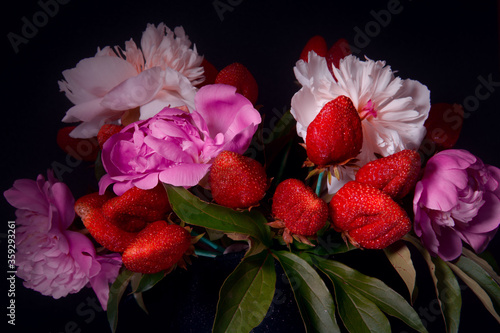 Strawberry bouquet. Bouquet of peonies with strawberries.