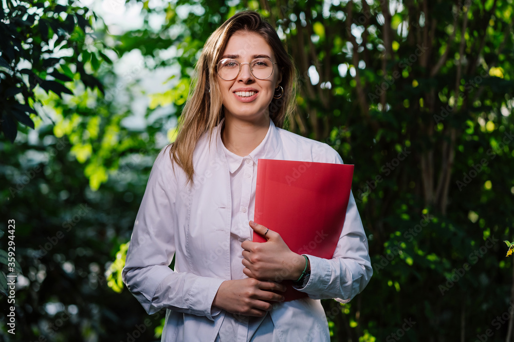 Young female scientist looking at the camera Young female scientist looking at the camera
