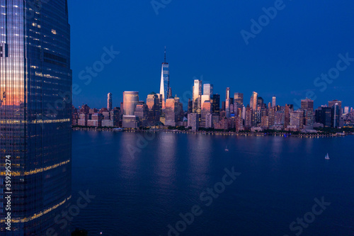 Aerial view of lower Manhattan at dusk from Hudson river. 