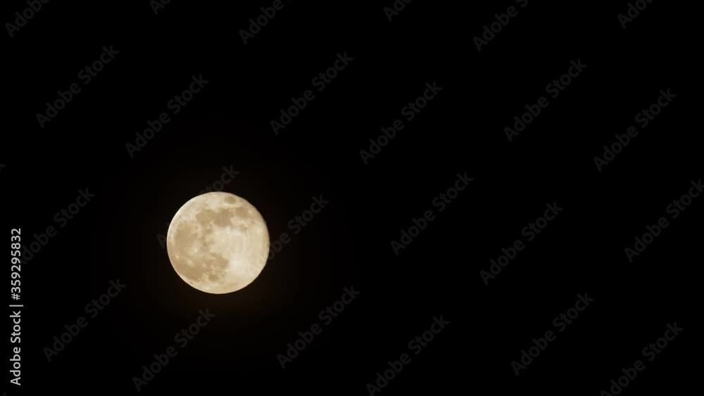 Full moon in the night sky.Time lapse Full moon in the night sky.Time lapse