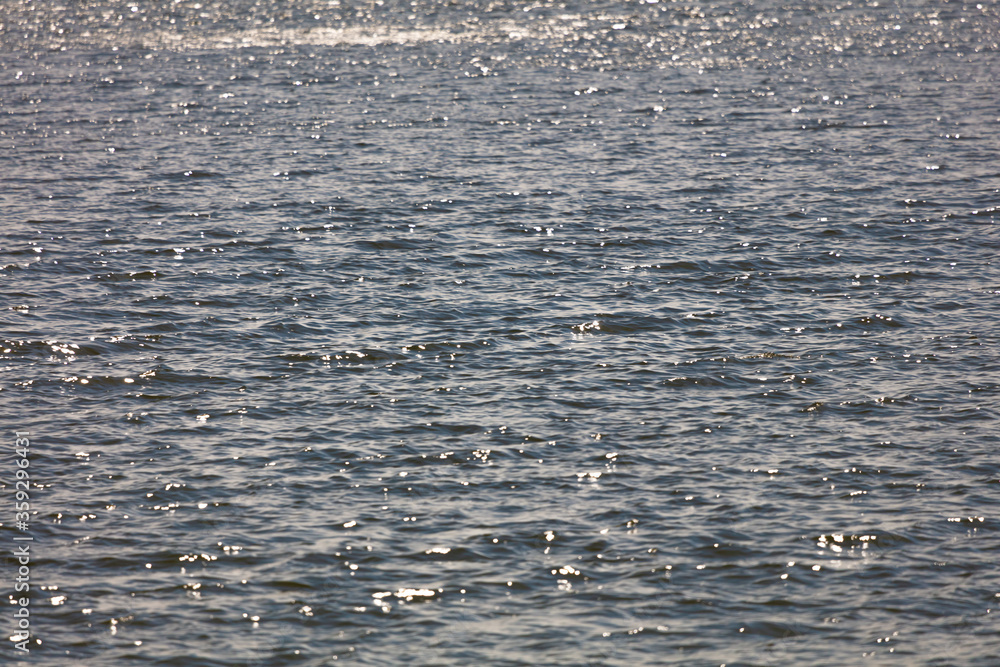 The reflection of the sun in the water. Glare and ripple on the water ...