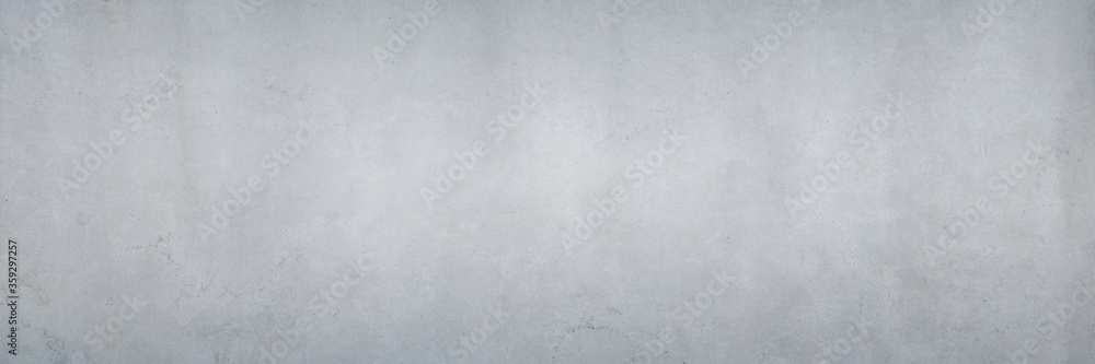 Texture of a smooth, gray concrete wall as a background