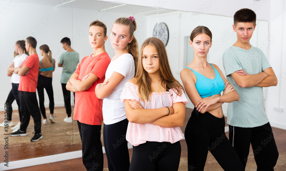 Teenagers with choreographer in dance studio