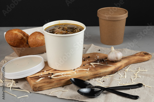 Eco packaging - soup in a craft glass for soup for a delivery service. Vegan food.