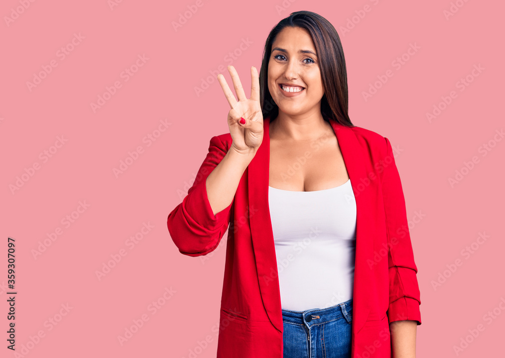 Young beautiful brunette woman wearing elegant clothes showing and pointing up with fingers number three while smiling confident and happy. Young beautiful brunette woman wearing elegant clothes showing and pointing up with fingers number three while smiling confident and happy.