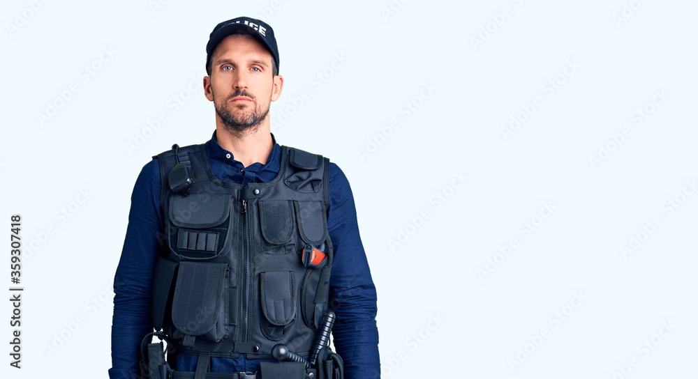 Young handsome man wearing police uniform looking sleepy and tired, exhausted for fatigue and hangover, lazy eyes in the morning. Young handsome man wearing police uniform looking sleepy and tired, exhausted for fatigue and hangover, lazy eyes in the morning.