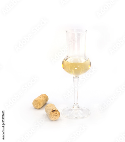 Dry sweet white wine in a small tasting glass isolated on white background. For winery, bar or restaurant degustation event ads, cards posters.