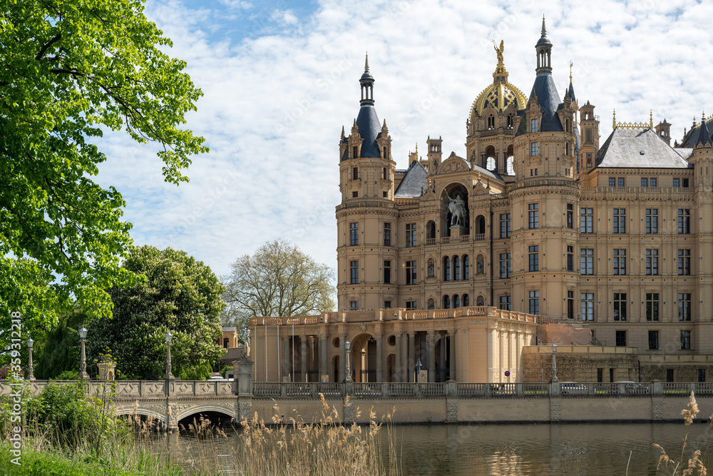 Portal and entrance of the Schwerin Castle or Schwerin palace, in German Schweriner Schloss, a romantic landmark building on a lake in the capital city of Mecklenburg