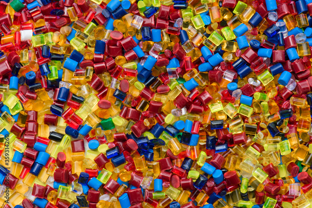 lot of colored plastic resin granulates
