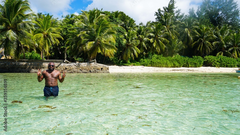 Athletic Black man on summer vacation on the beach