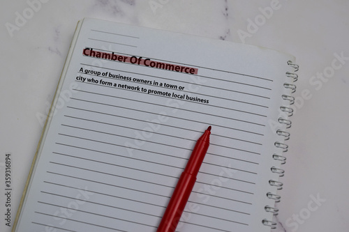 Definition of Chamber of Commerce word with a meaning on a book. dictionary concept