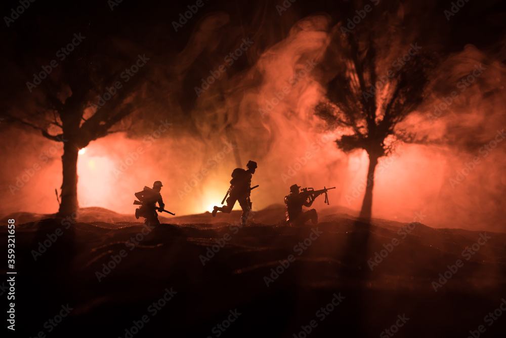 Fototapeta premium War Concept. Military silhouettes fighting scene on war fog sky background, World War Soldiers Silhouette Below Cloudy Skyline At night.