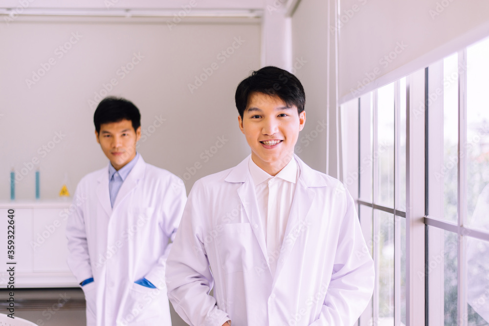 Asian men scientist smiling face and working in hospital,Professional medical teamwork Asian men scientist smiling face and working in hospital,Professional medical teamwork