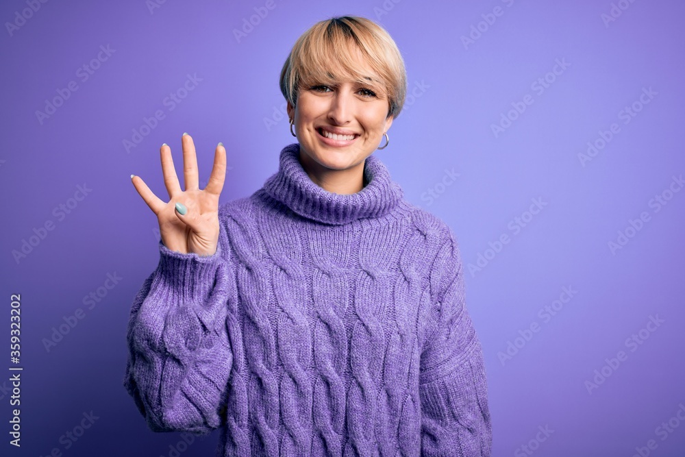 Young blonde woman with short hair wearing winter turtleneck sweater over purple background showing and pointing up with fingers number four while smiling confident and happy. Young blonde woman with short hair wearing winter turtleneck sweater over purple background showing and pointing up with fingers number four while smiling confident and happy.