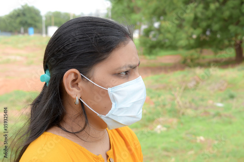 asian lady wearing medical mask  for protection from viruses and bacterias durind covid 19 pandemic photo