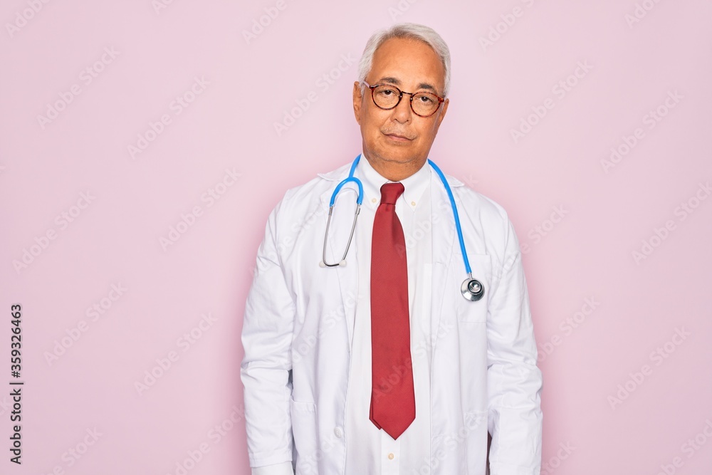 Middle age senior grey-haired doctor man wearing stethoscope and professional medical coat looking sleepy and tired, exhausted for fatigue and hangover, lazy eyes in the morning. Middle age senior grey-haired doctor man wearing stethoscope and professional medical coat looking sleepy and tired, exhausted for fatigue and hangover, lazy eyes in the morning.