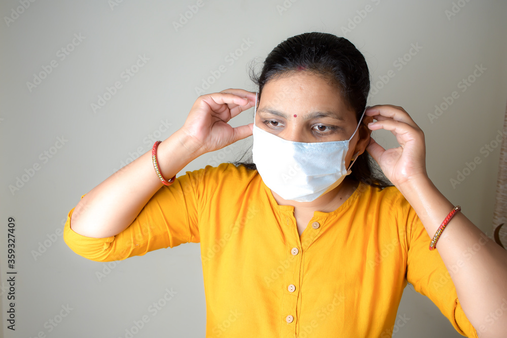 asian lady wearing medical mask for protection from viruses and bacterias durind covid 19 pandemic asian lady wearing medical mask for protection from viruses and bacterias durind covid 19 pandemic