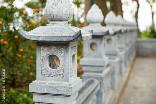 Garden lantern lining up in Tran Quoc Pagoda Hanoi, Vietnam