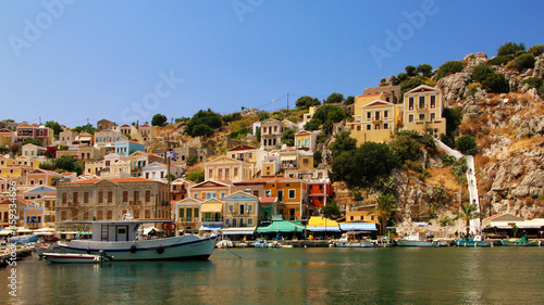 Symi town, Symi island, pictorial view of colorful houses and Yialos harbour