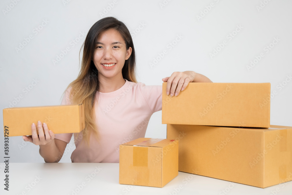 Asia woman Start up for Business Online. People with online shopping SME entrepreneur or freelance working concept. Banner size Asia woman Start up for Business Online. People with online shopping SME entrepreneur or freelance working concept. Banner size
