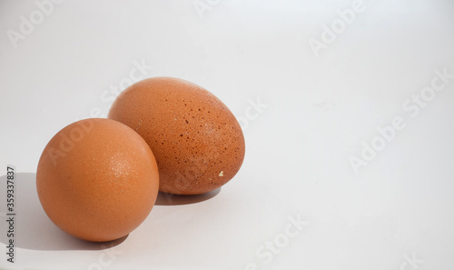 fresh chicken eggs on isolated white background