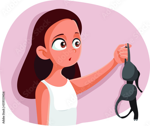  Teen Girl Experiencing Puberty Holding a Bra