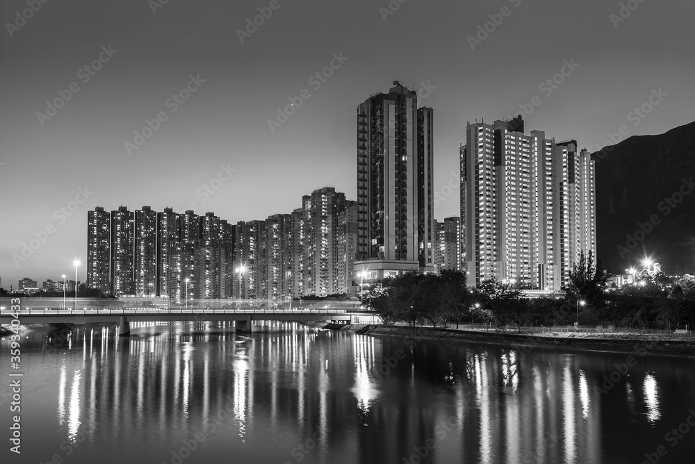 High rise residential building and mountain in Hong Kong city at dusk
