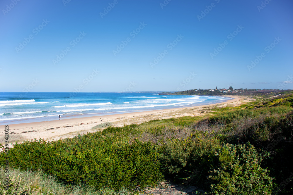 Scenic view of beauriful sandy Bendalong Beach on sunny day. Bendalong, NSW, Australia.