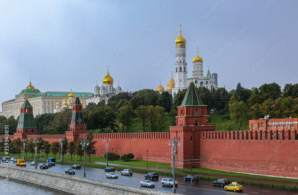 The Kremlin wall, tower and domes of cathedrals blurred in a winter snow storm with snowflakes in the air, Moscow Russia The Kremlin wall, tower and domes of cathedrals blurred in a winter snow storm with snowflakes in the air, Moscow Russia