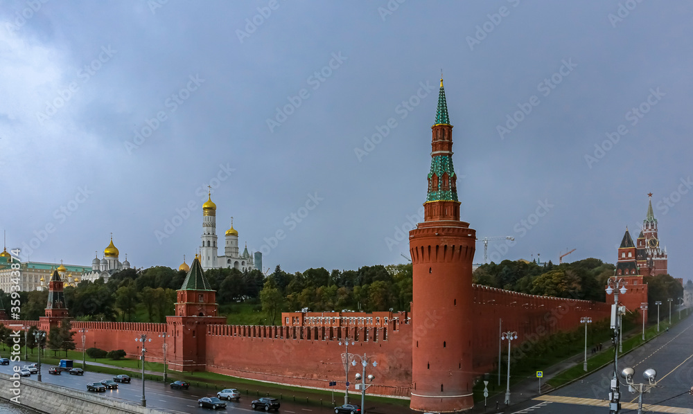 The Kremlin wall, tower and domes of cathedrals blurred in a winter snow storm with snowflakes in the air, Moscow Russia