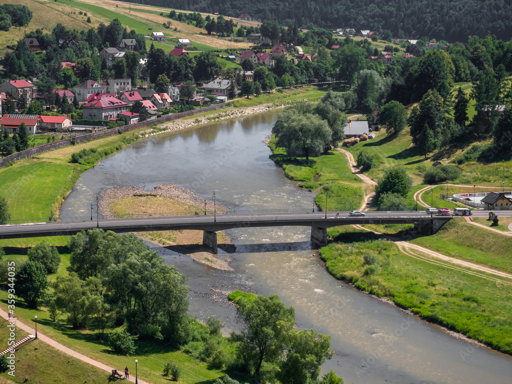 Bridge over Poprad river in spa town Muszyna in summer in southern Poland. View from ruins of castle on Zamczysko mountain.