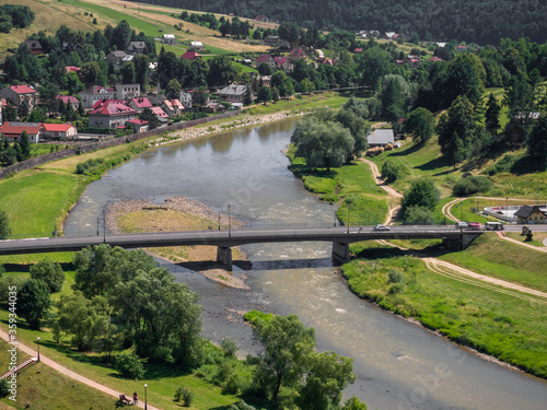 Bridge over Poprad river in spa town Muszyna in summer in southern Poland. View from ruins of castle on Zamczysko mountain. © ffolas