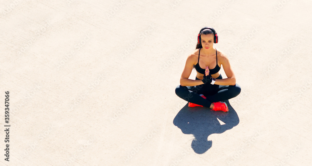 Fototapeta premium Young, fit and sporty woman doing exercises outdoor. Fitness, sport and healthy lifestyle.