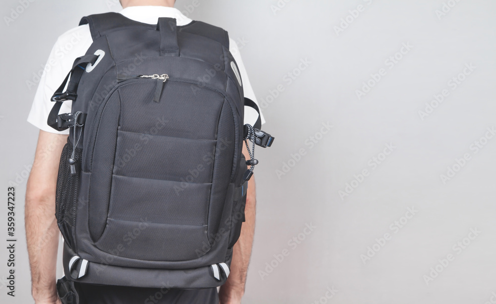 Caucasian man with backpack in office. Caucasian man with backpack in office.