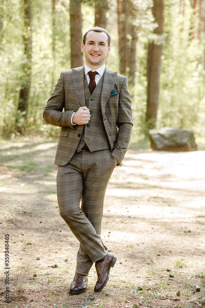 man in suit outdoors. businessman in a suit in the park man in suit outdoors. businessman in a suit in the park