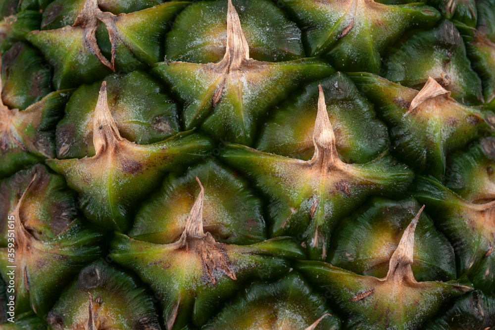 Healthy eating, vegetarian diet and refreshing tropical fruits concept with full frame close up photograph of textured ripe pineapple skin background Healthy eating, vegetarian diet and refreshing tropical fruits concept with full frame close up photograph of textured ripe pineapple skin background