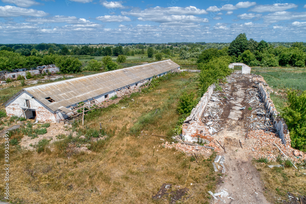 Abandoned and destroyed rural farm, aerial view